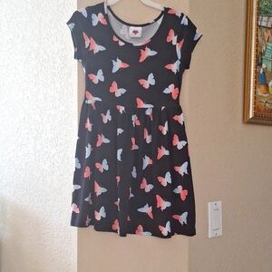 A black dress with pink and blue butterflies